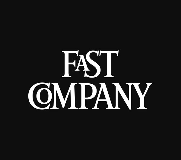 A logo of Fast company.